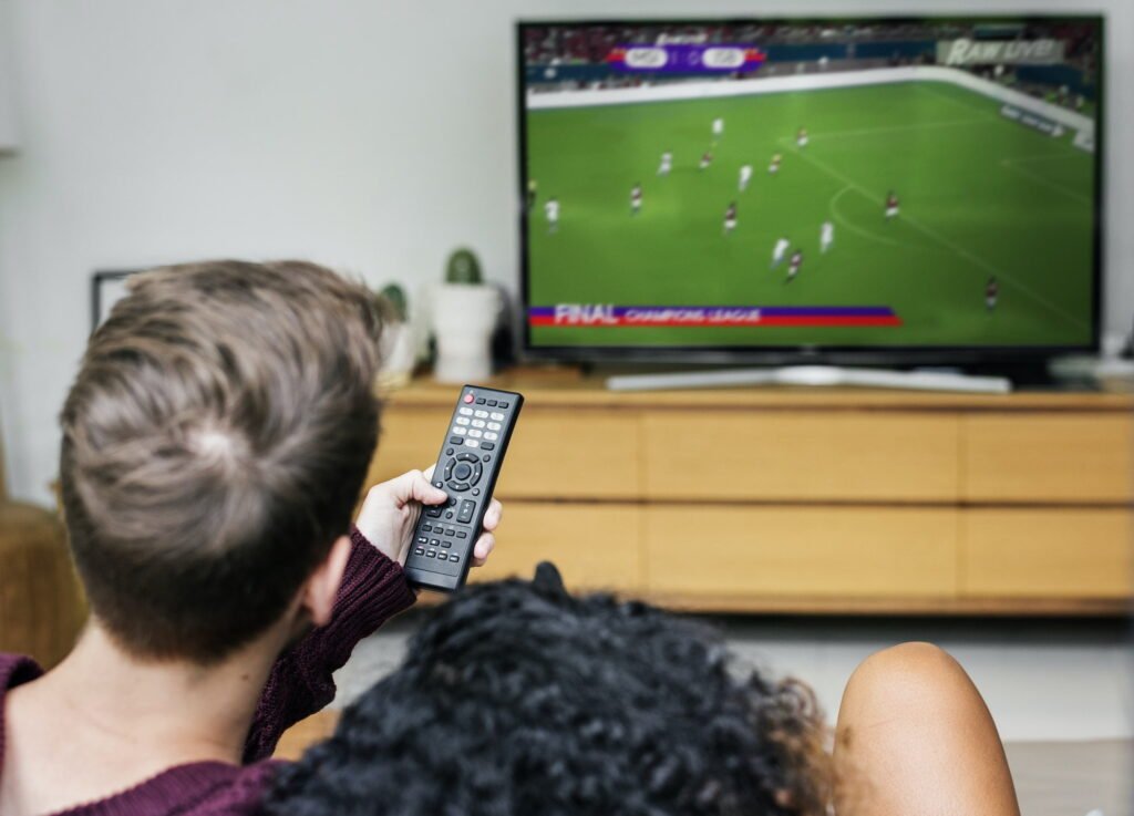 a couple watch a match soccer in best IPTV